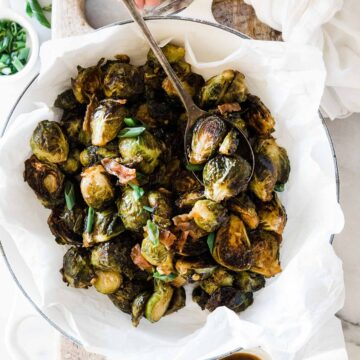 Teriyaki roasted Brussels sprouts recipe in a white braiser.