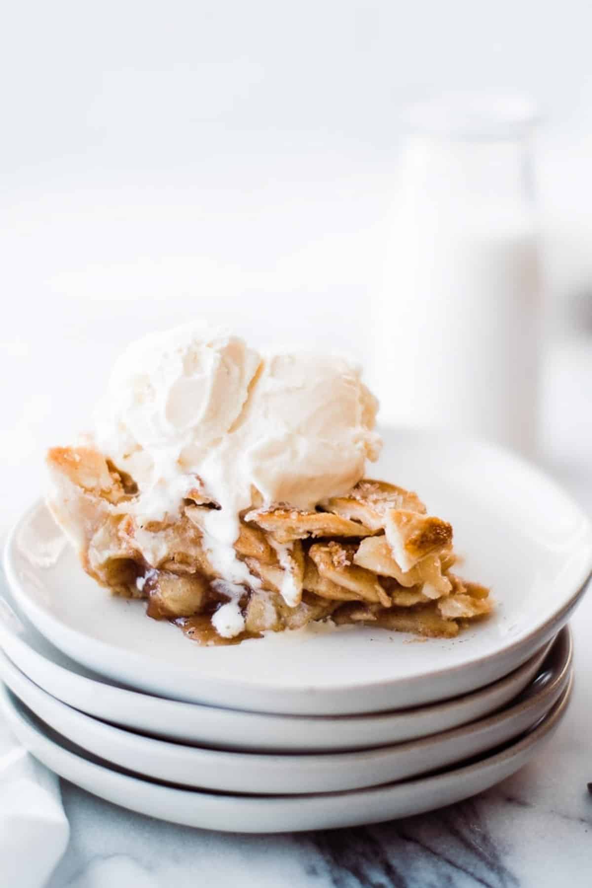 side view of apple pie with ice cream on top