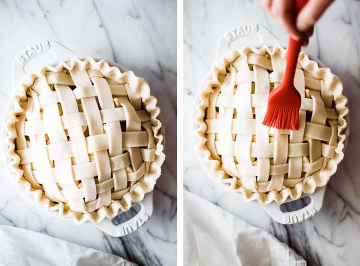 red silicone brush brushing butter over the top of a lattice apple pie