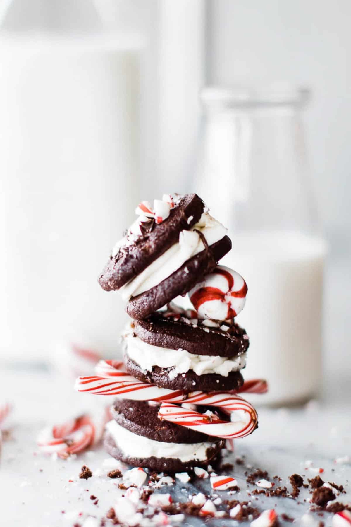 stack of three chocolate chip peppermint cookies with mints inbetween