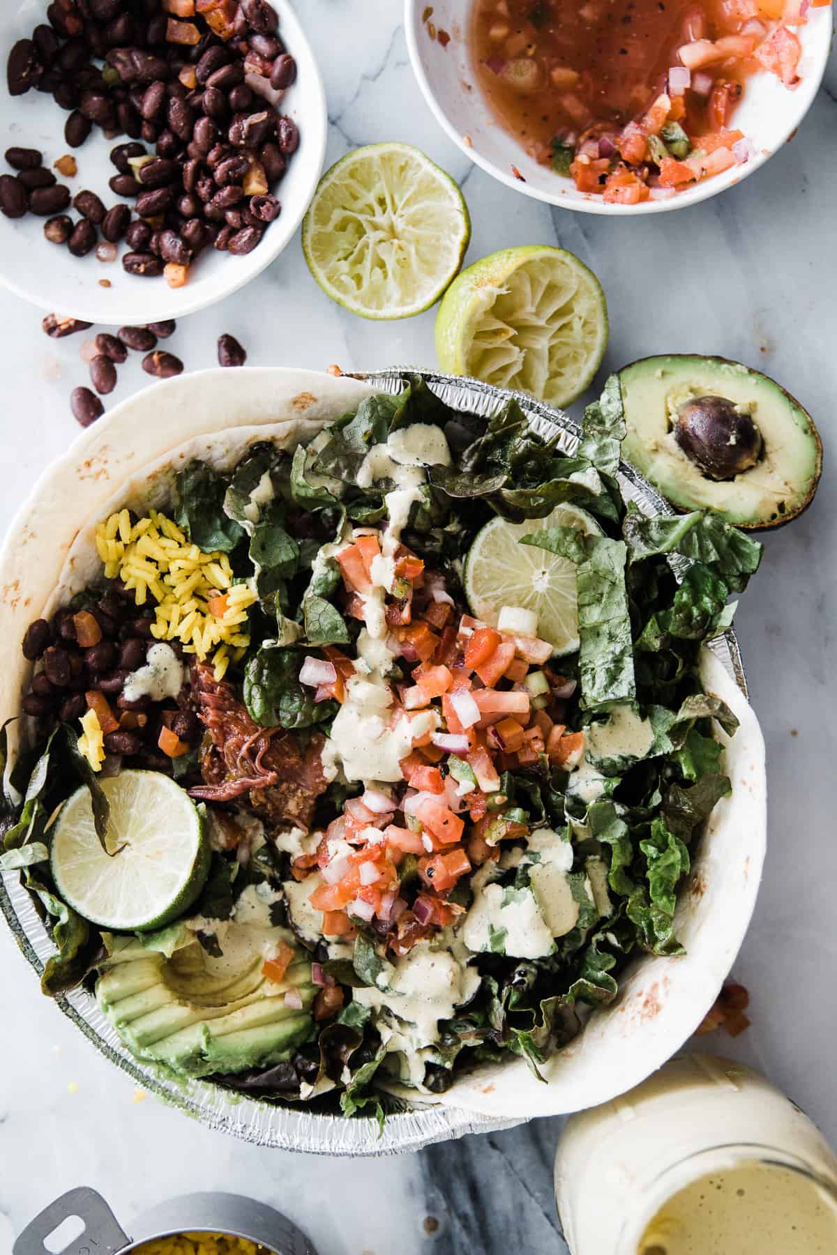 large salad with Pico de Gallo, rice, sweet pulled pork, avocado