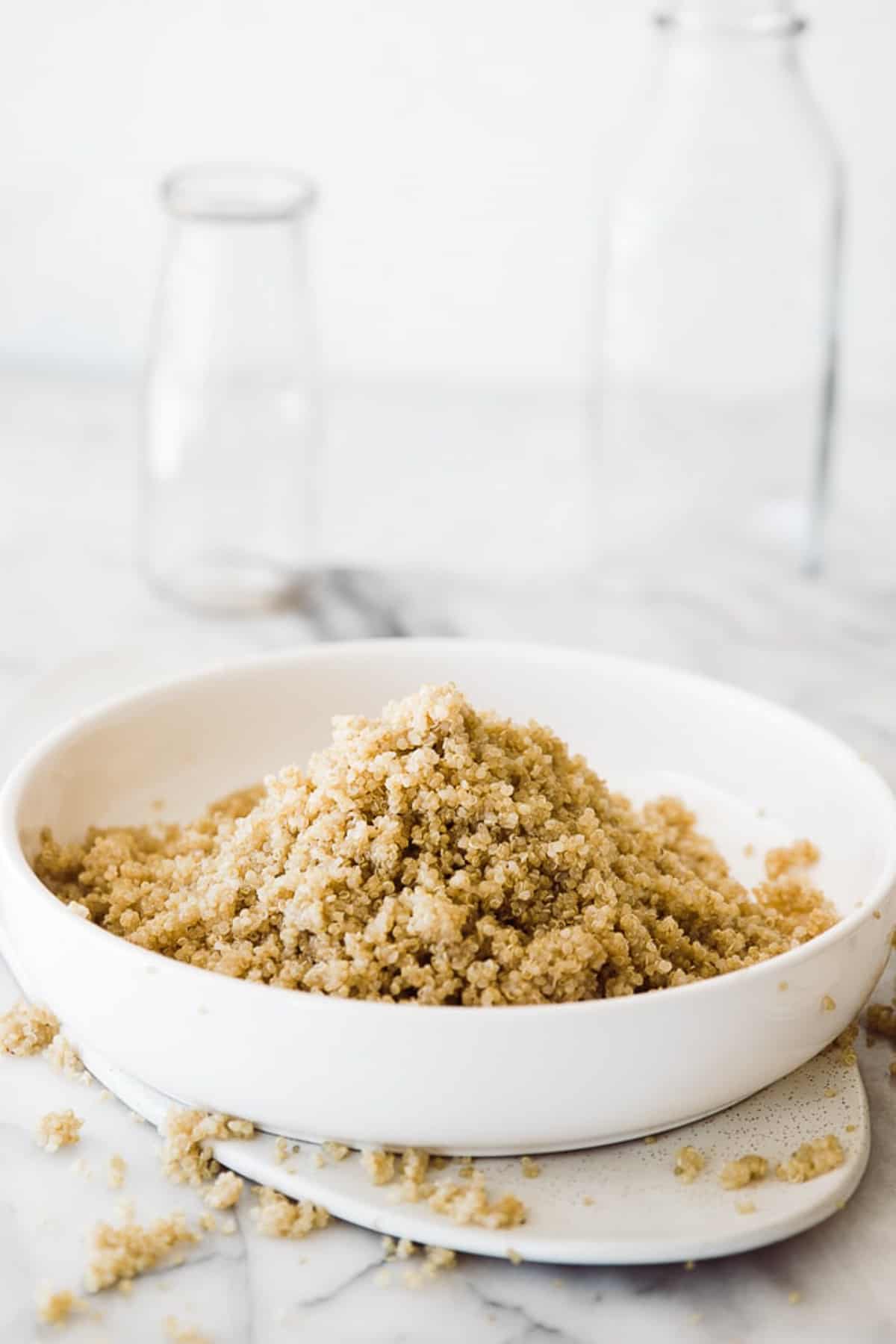 a white bowl of fluffy instant pot quinoa 