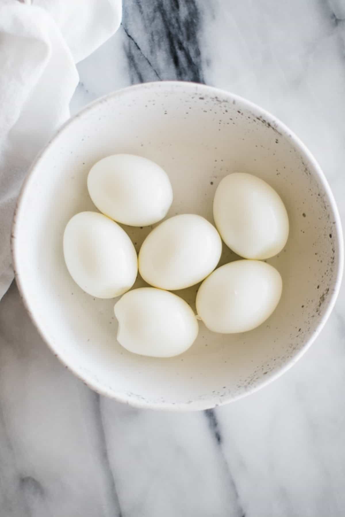 several hard boiled eggs in a bowl