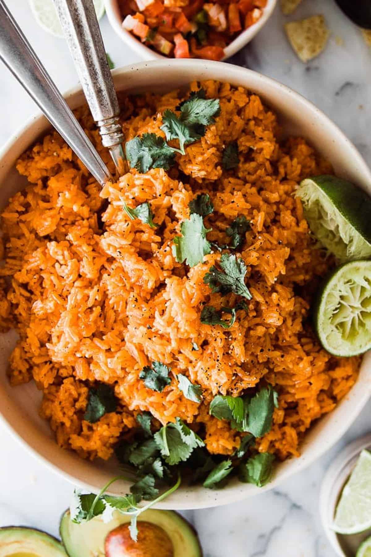 large bowl of instant pot Mexican rice with two serving spoons