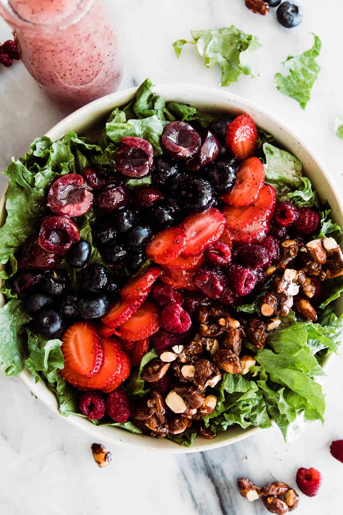 Large bowl of blue berry salad.