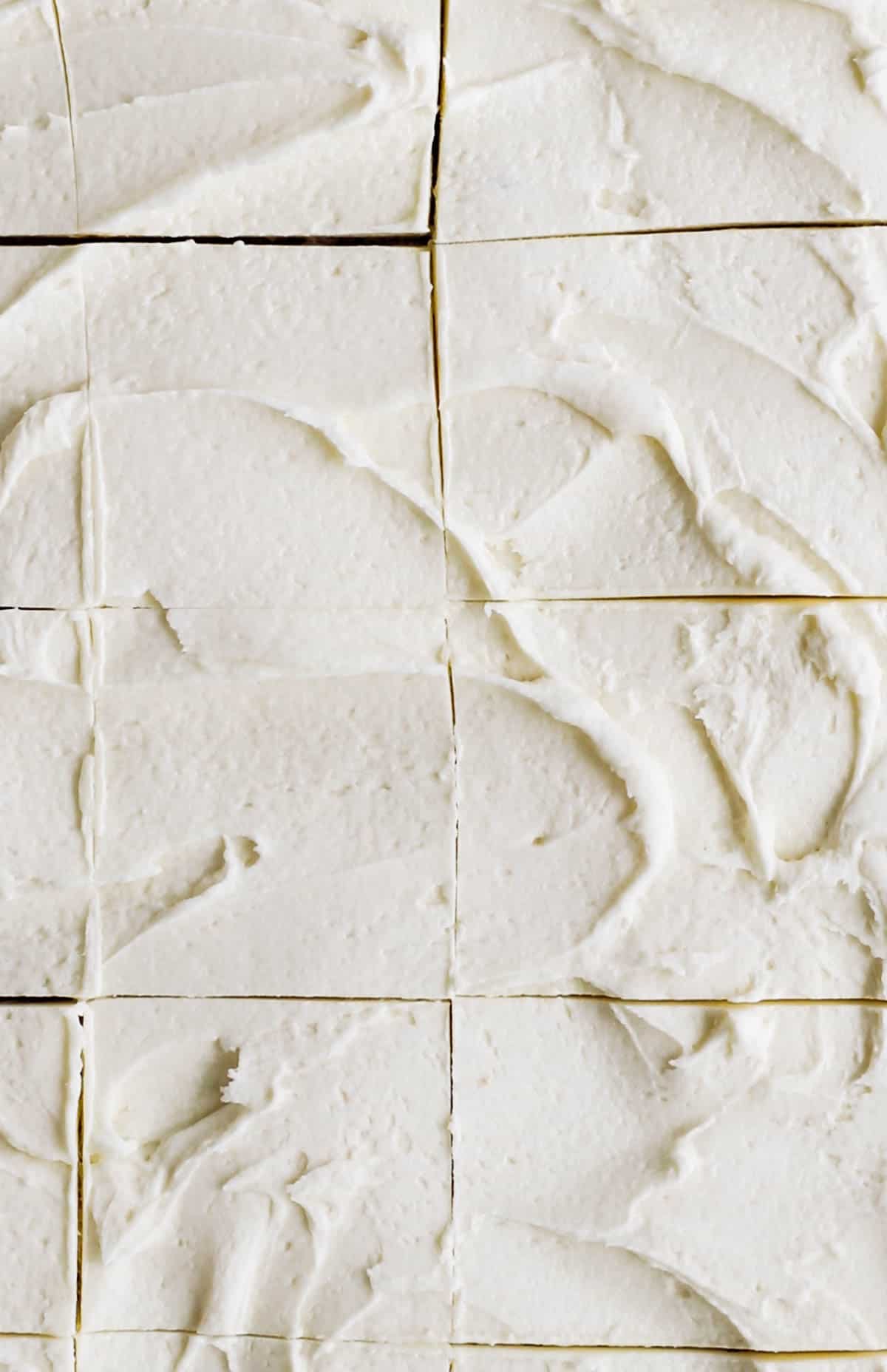 Frosted Banana Bars evenly cut into squares. 