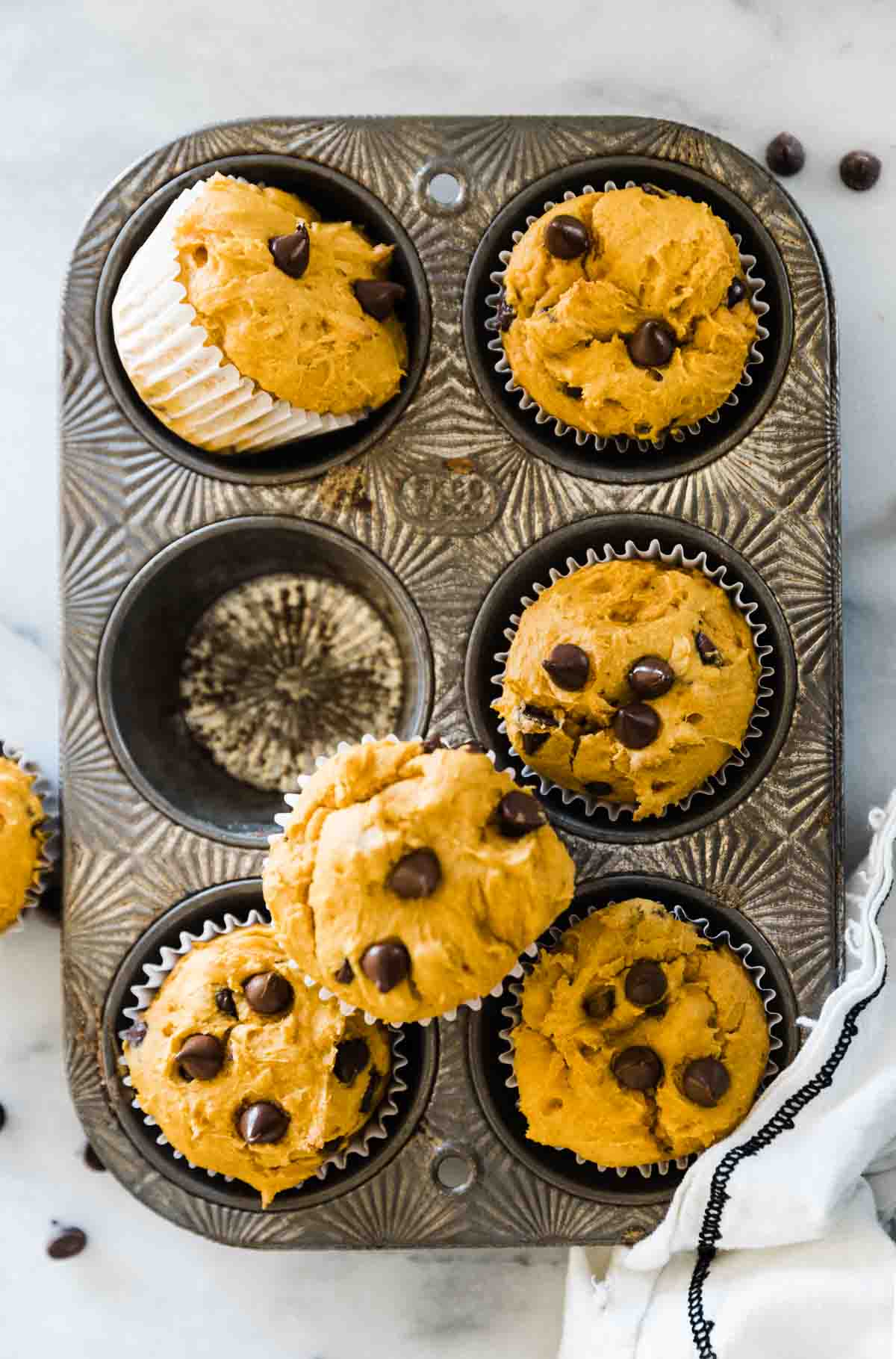 Easy pumpkin muffins in a silver cupcake tin.