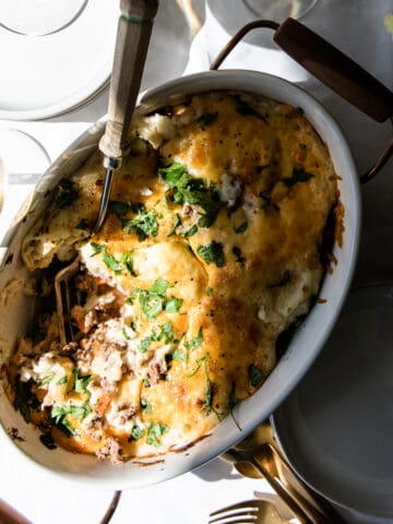 Lamb shepherds pie in oval dish with cheese
