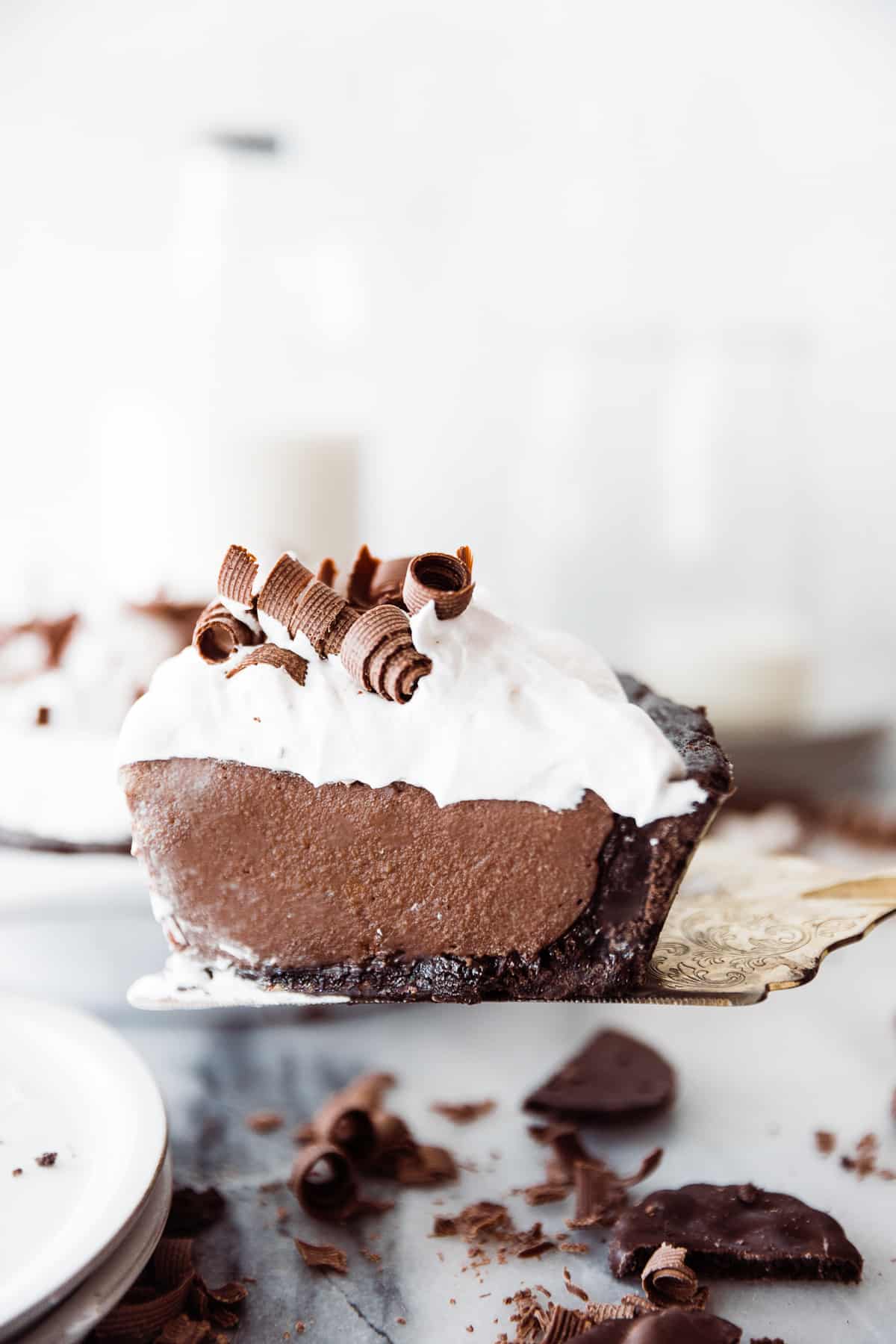 One slice of chocolate cream pie with a mint cookie pie crust. 