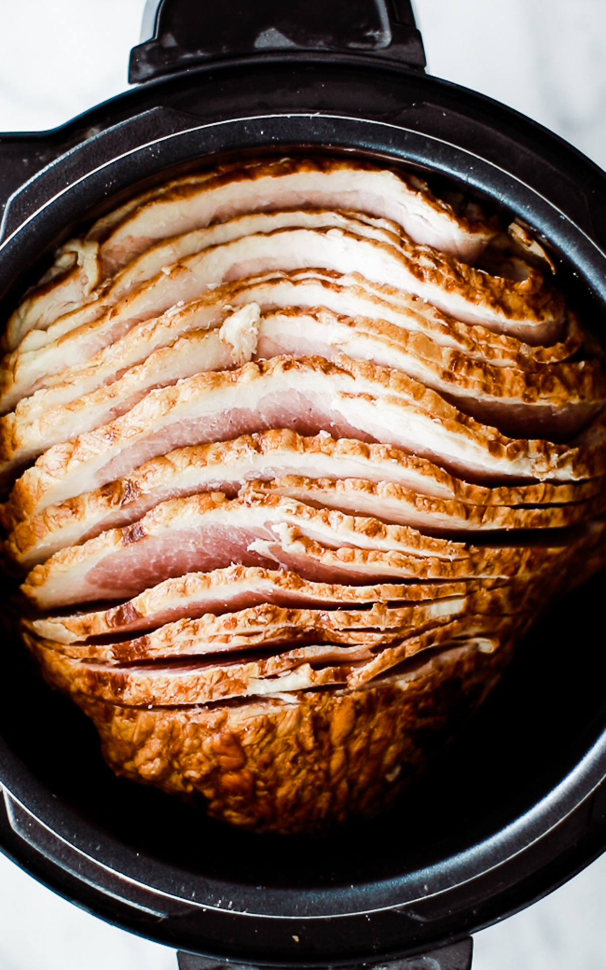 Spiral cut ham inside a pressure cooker. 