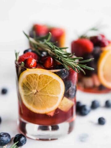A close up of virgin sangria in a whiskey glass.