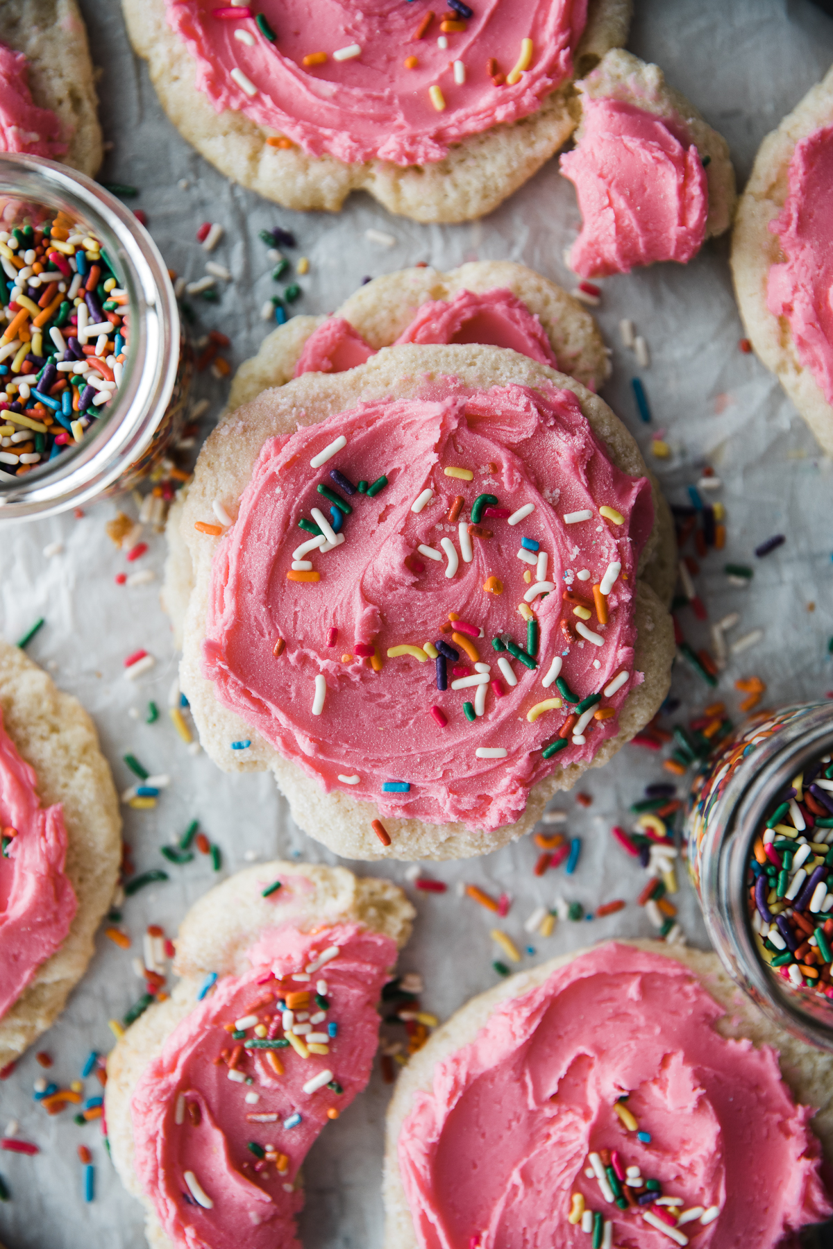 Sour Cream cookies with pink frosting and rainbow sprinkles. 