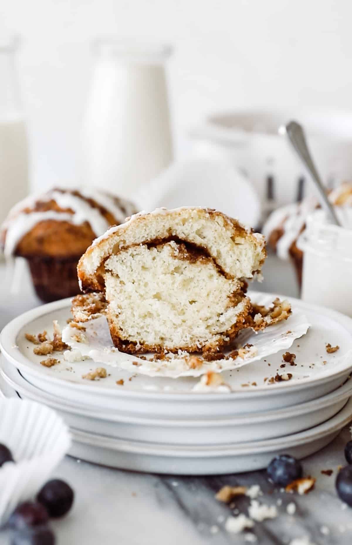 Fluffy coffee cake muffin with cinnamon sugar swirl in the middle.
