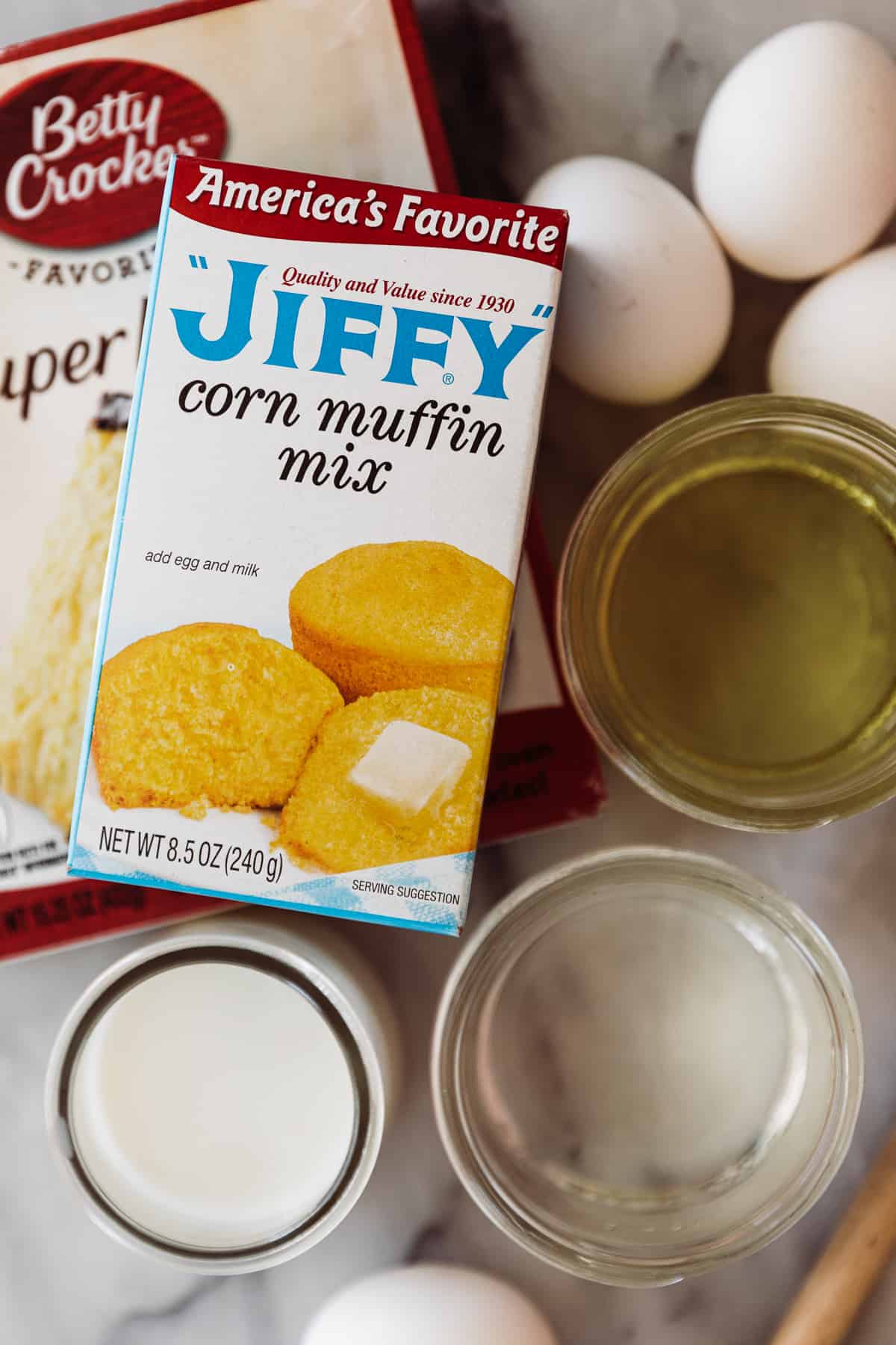 Two box mixes eggs, water milk and oil as ingredients for the cornbread batter. 