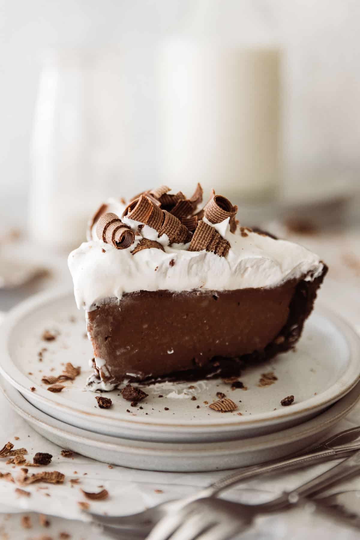 One slice of chocolate cream pie with a mint cookie pie crust. 