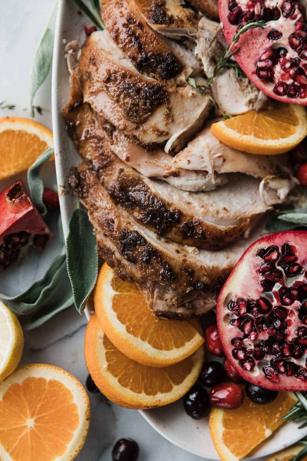 Sliced juicy thanksgiving turkey on a platter