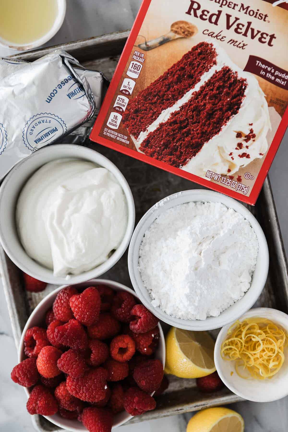 Ingredients for the red velvet trifle on a baking tray. 