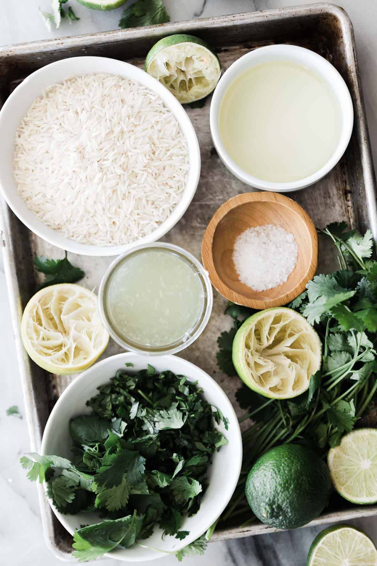 Ingredients for cilantro lime rice on a tray.
