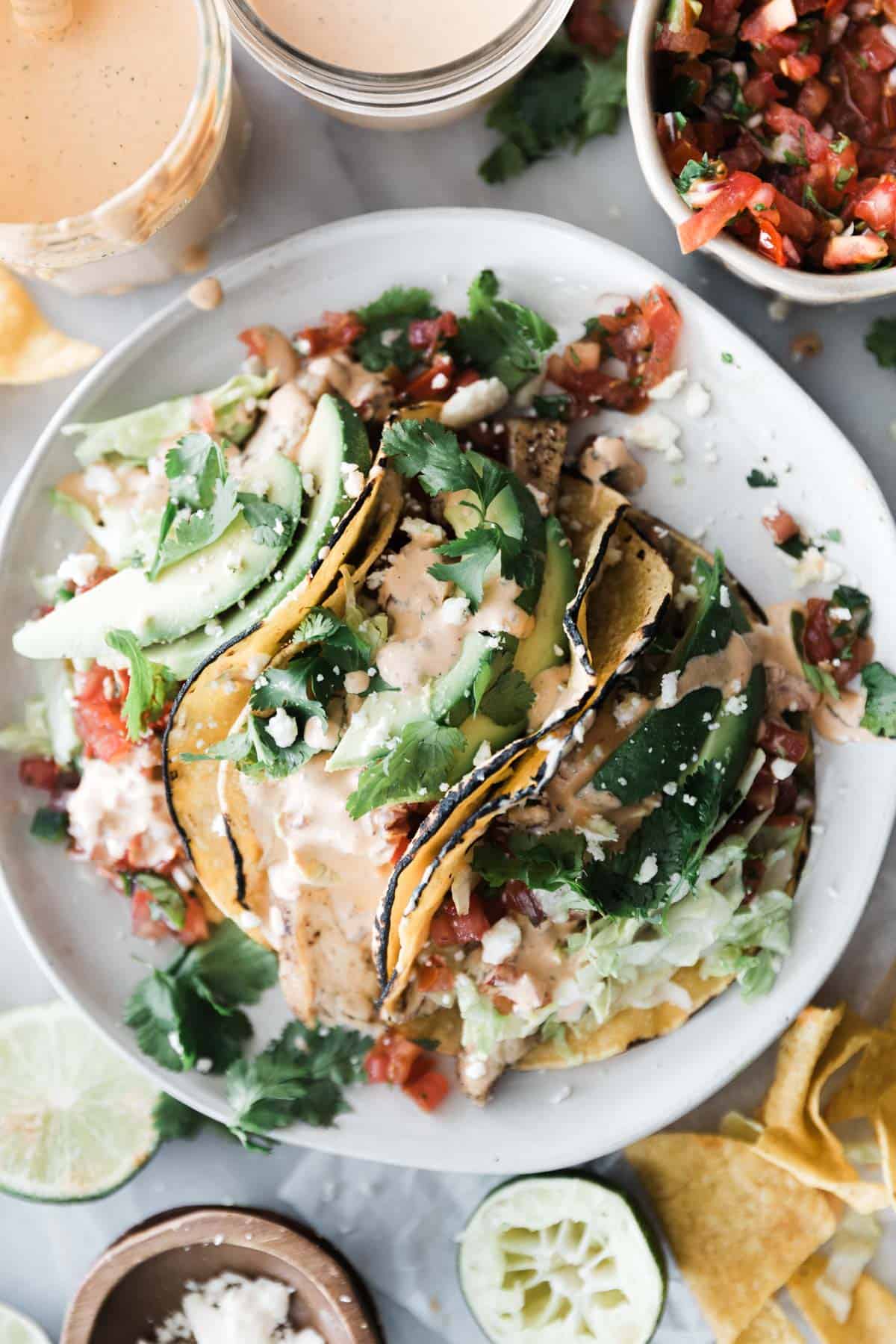 Grilled chicken tacos drizzled generously with a creamy chiptole tacos.
