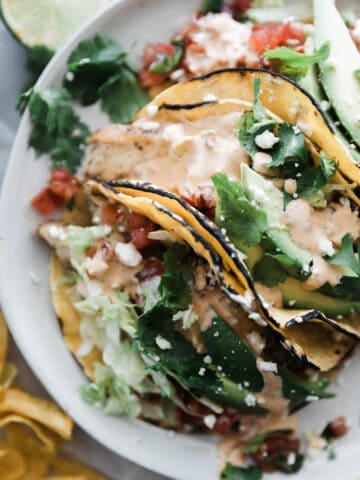 Grilled chicken tacos drizzled generously with a creamy chiptole tacos.