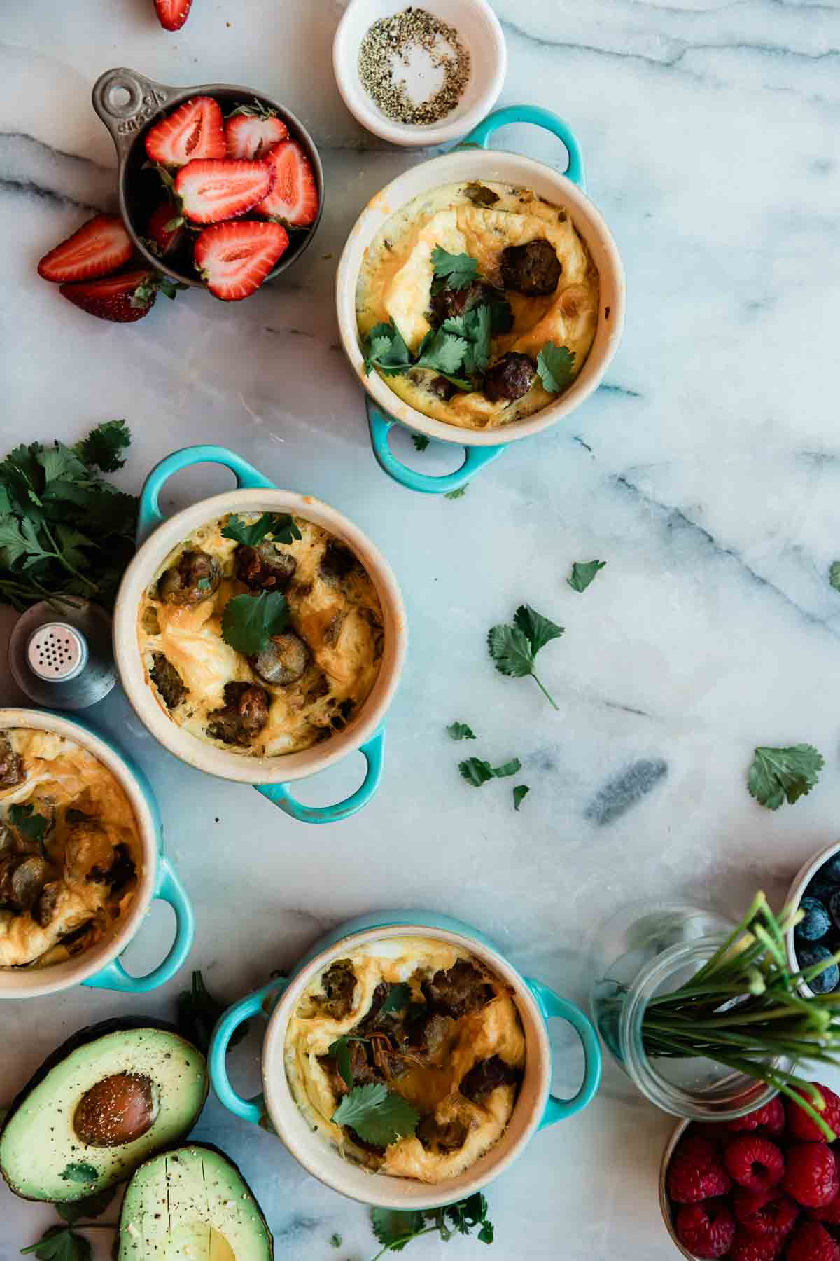Panera egg souffle in mini ramekins set on a marble counter.