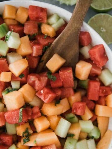 A bowl of melon salad with watermelon, cantaloupe, and honey dew in a bowl.