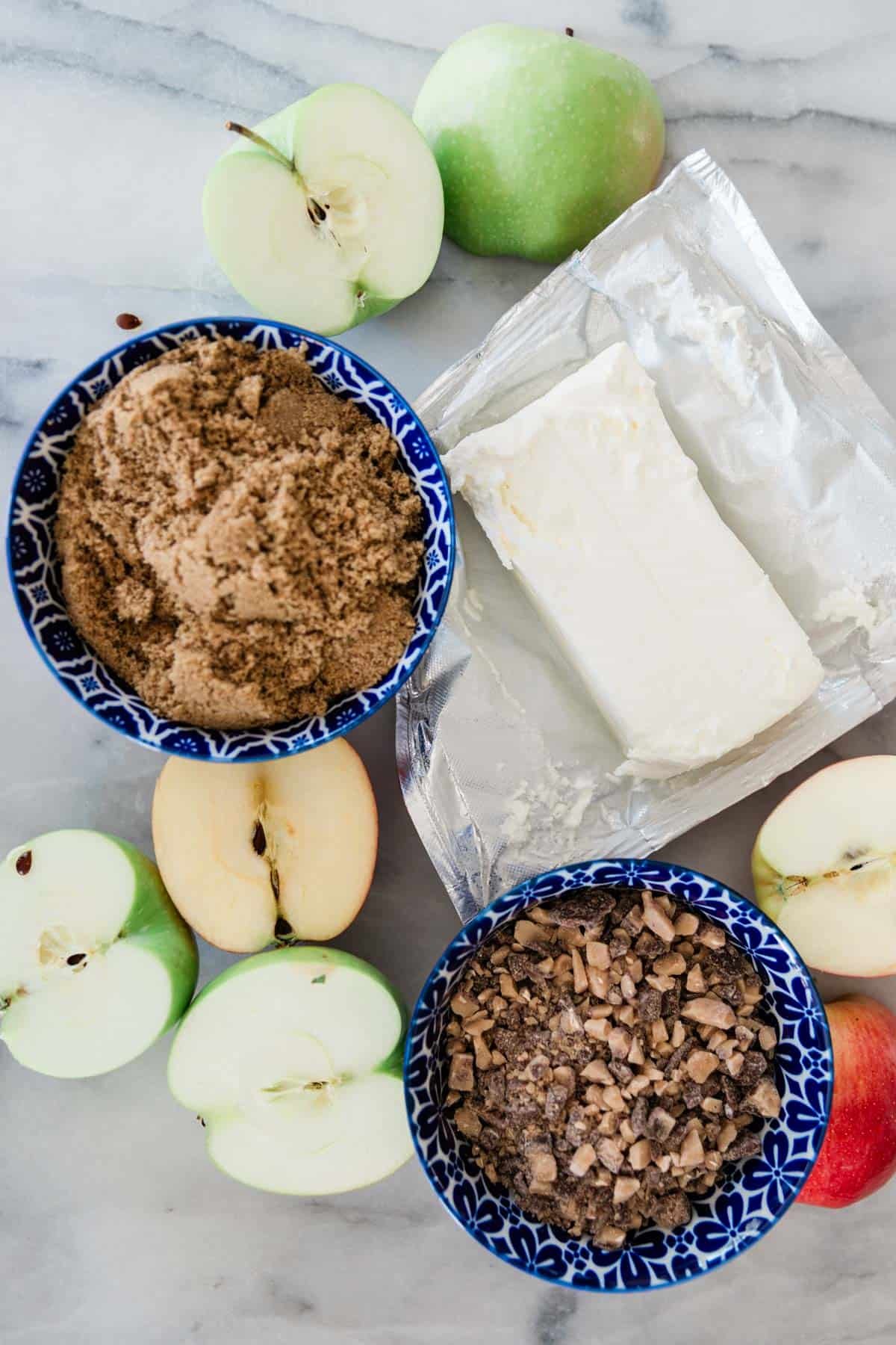 Ingredients to make cream cheese apple dip on the table. 