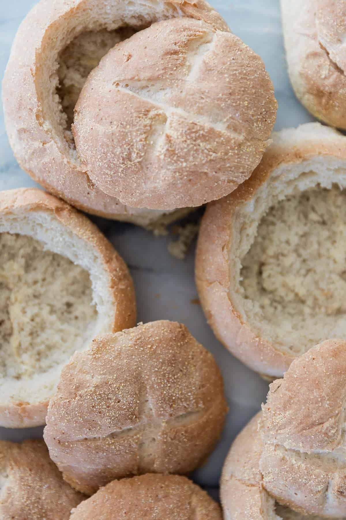 Homemade bread bowls on a table.