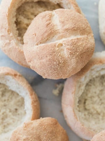 Homemade bread bowls on a table.