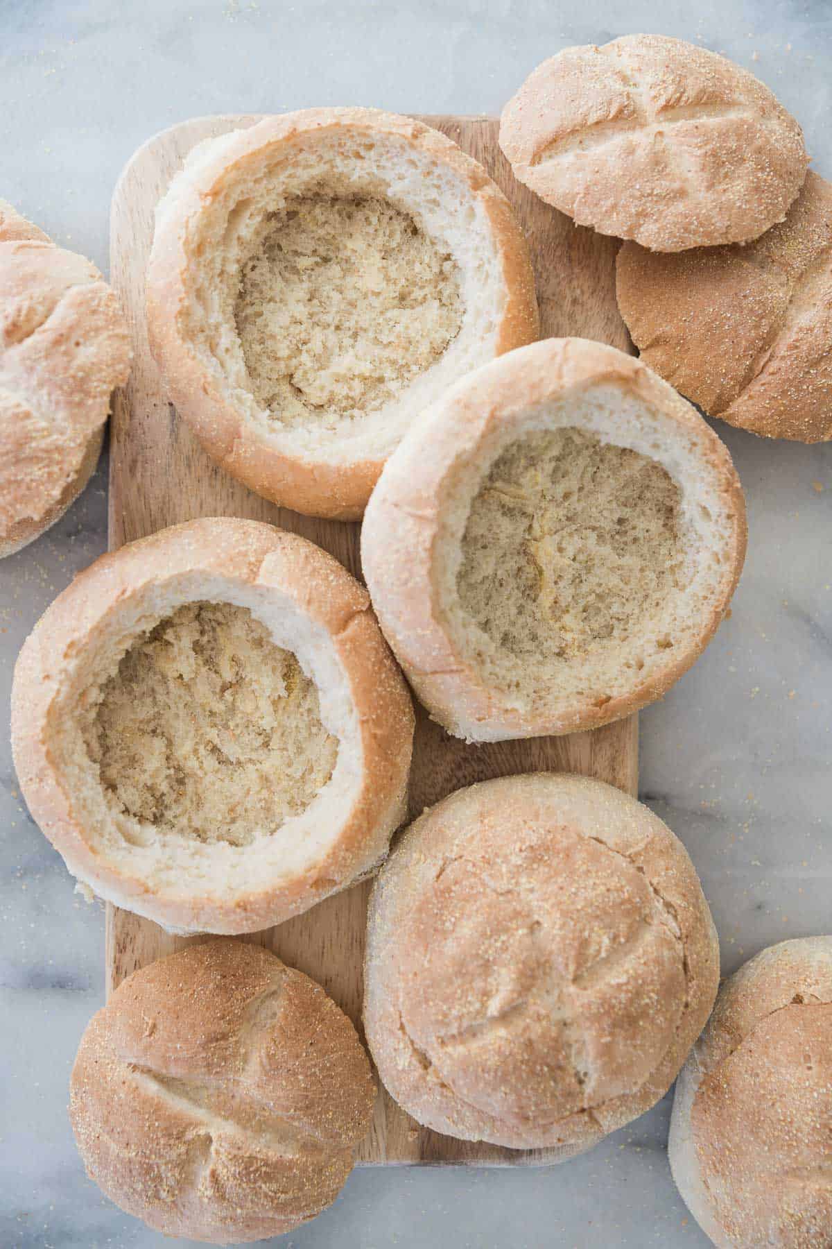 Homemade bread bowls on a table.
