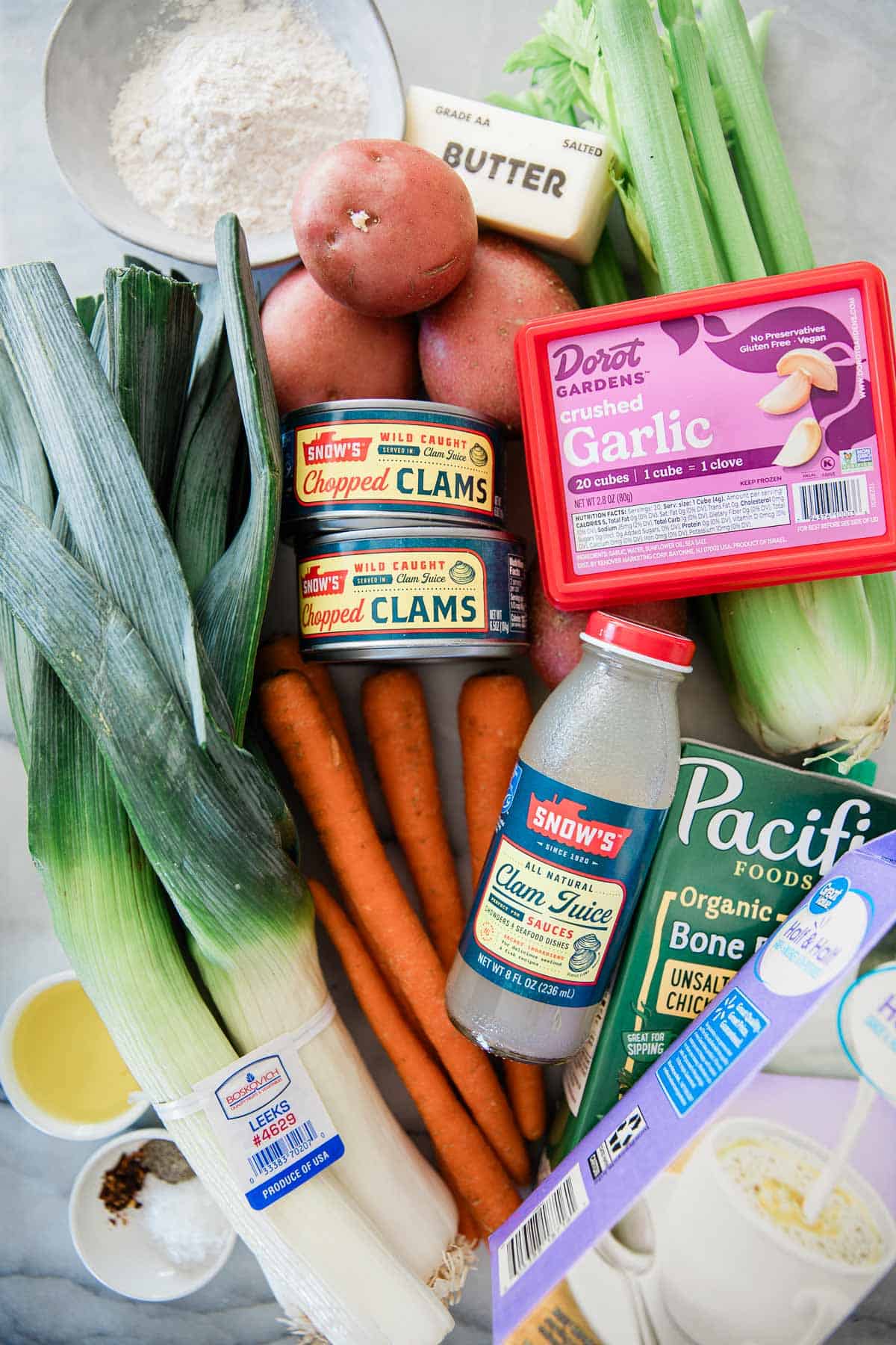 Ingredients to make New England clam chowder on a table.