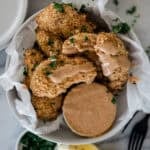 Ritz cracker chicken on a plate with dip.