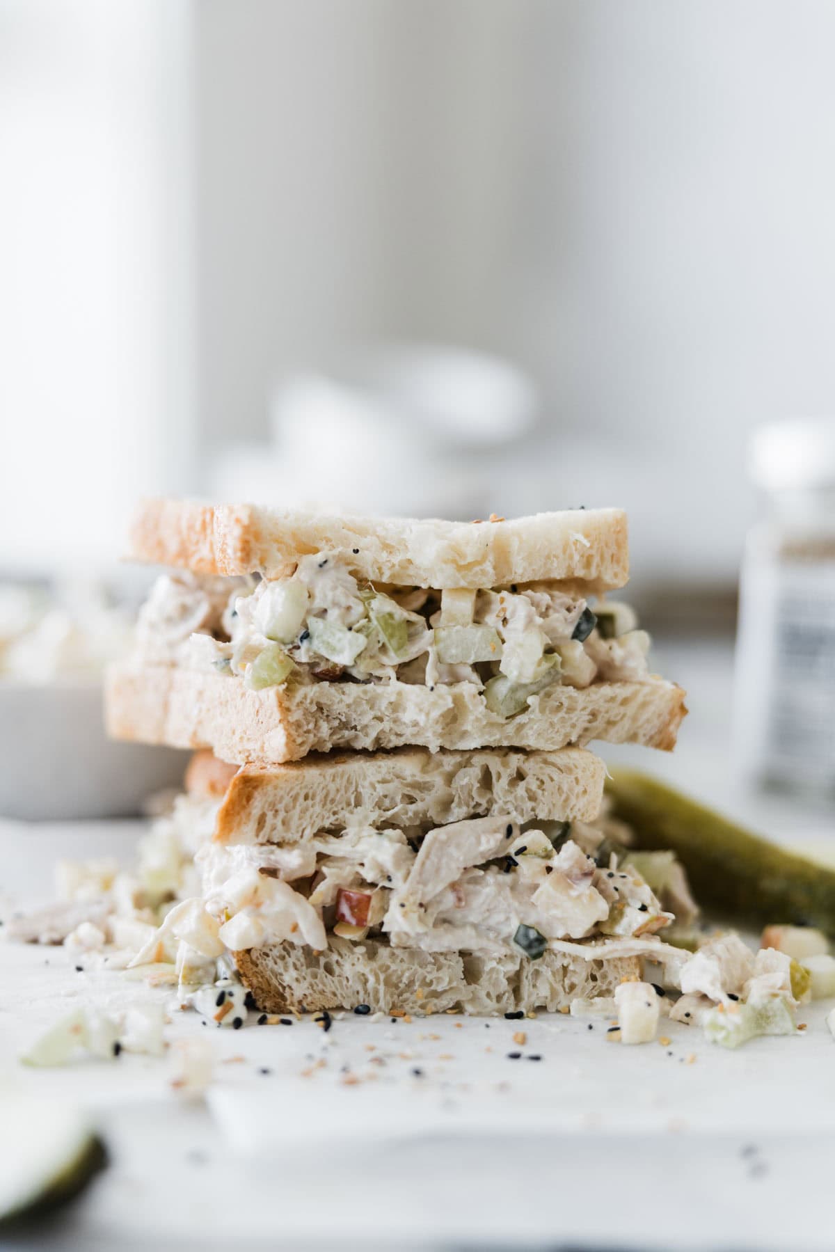 A stack of pickle chicken salad sandwiches.