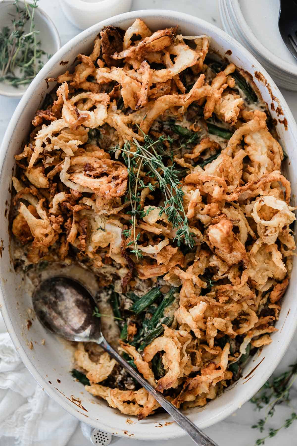 Green bean casserole using fresh green beans in a serving dish.