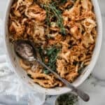 Fresh green bean casserole in an oval serving dish.