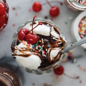 Hot fudge sauce on top of an ice cream sundae.
