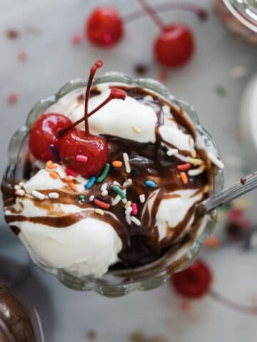 Hot fudge sauce on top of an ice cream sundae.