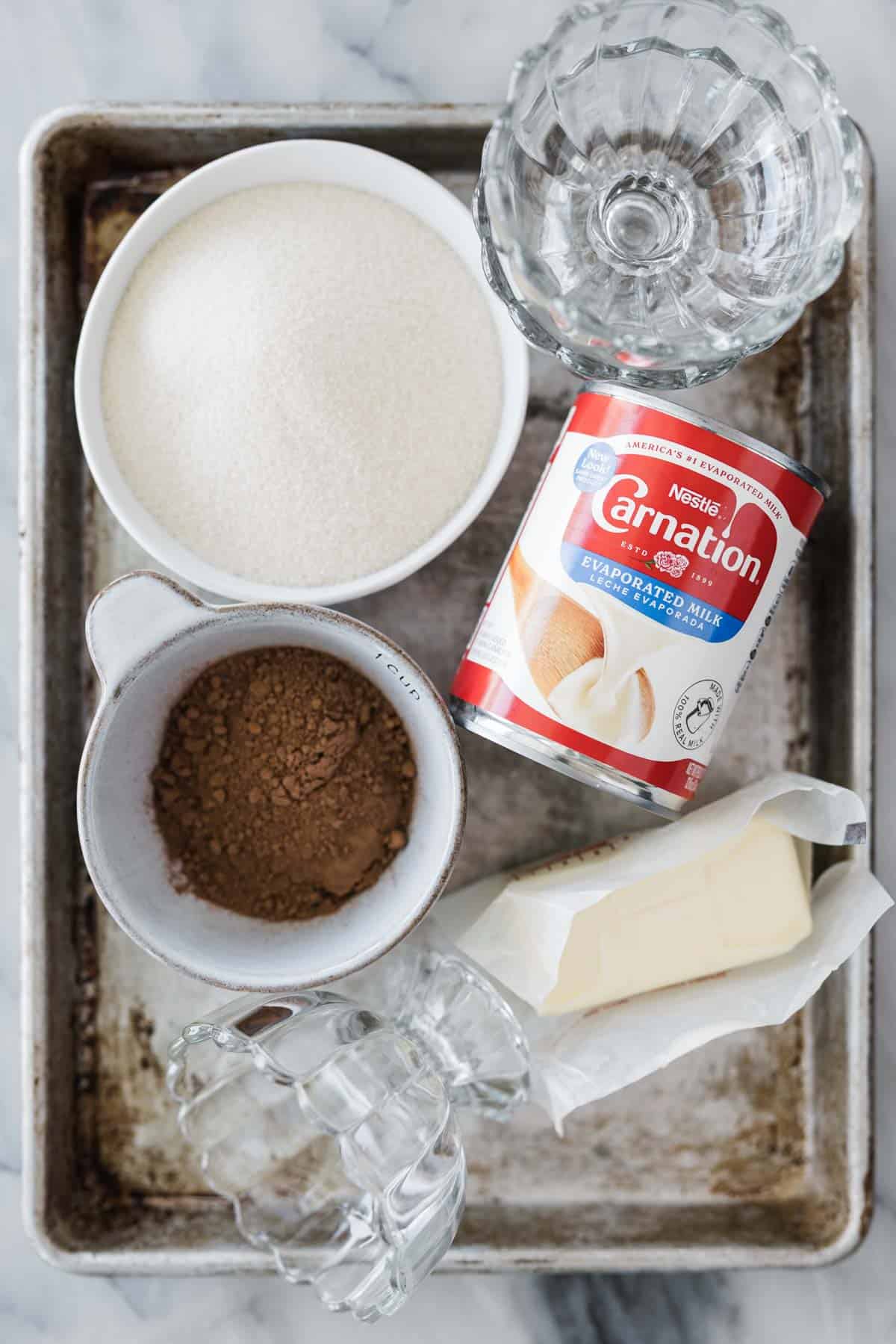 Ingredients for making this hot fudge recipe in bowls.