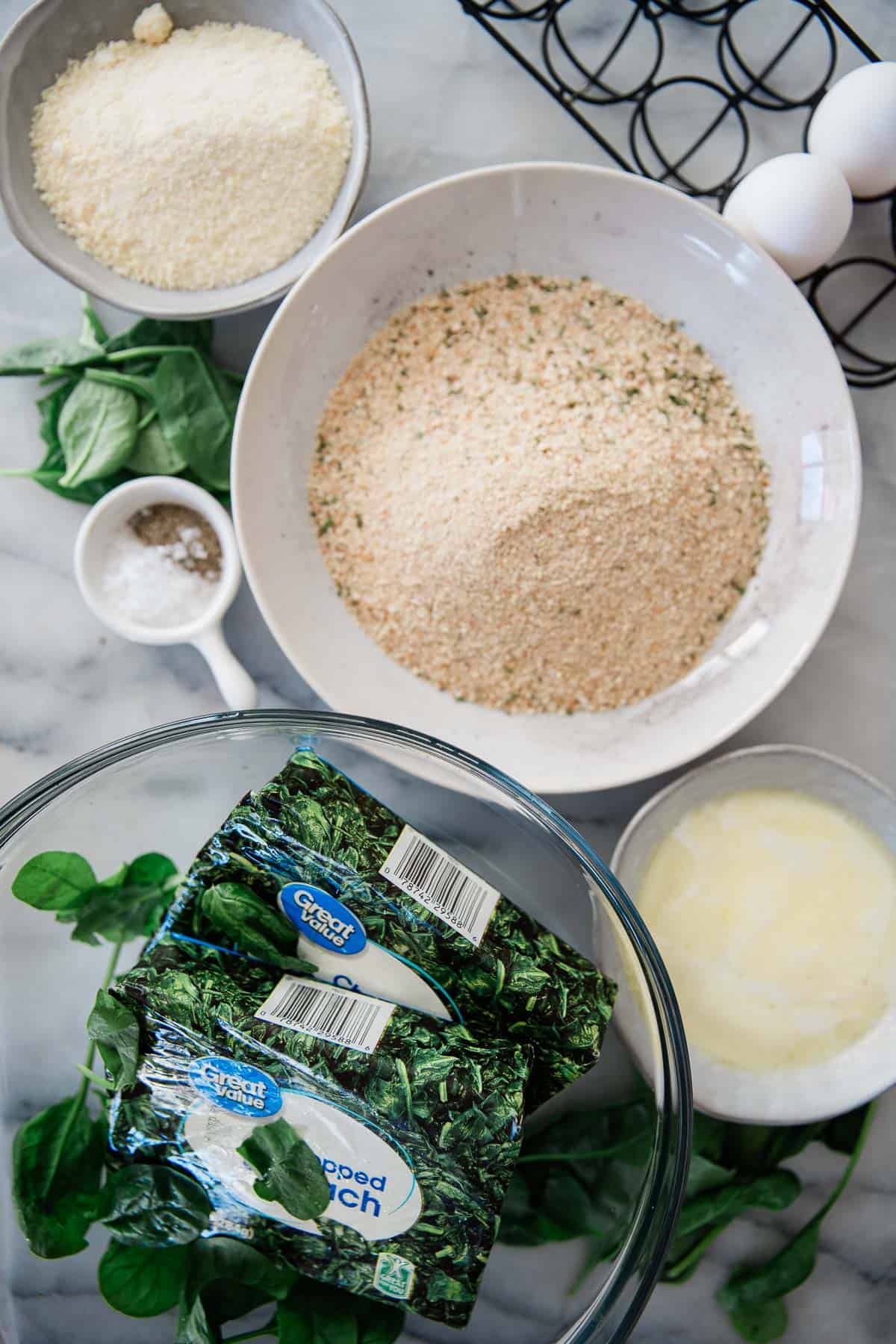 Ingredients for making spinach balls in bowls.
