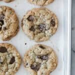 Coconut chocolate chip cookies on a baking sheet.