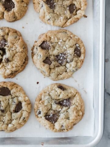 Coconut chocolate chip cookies on a baking sheet.