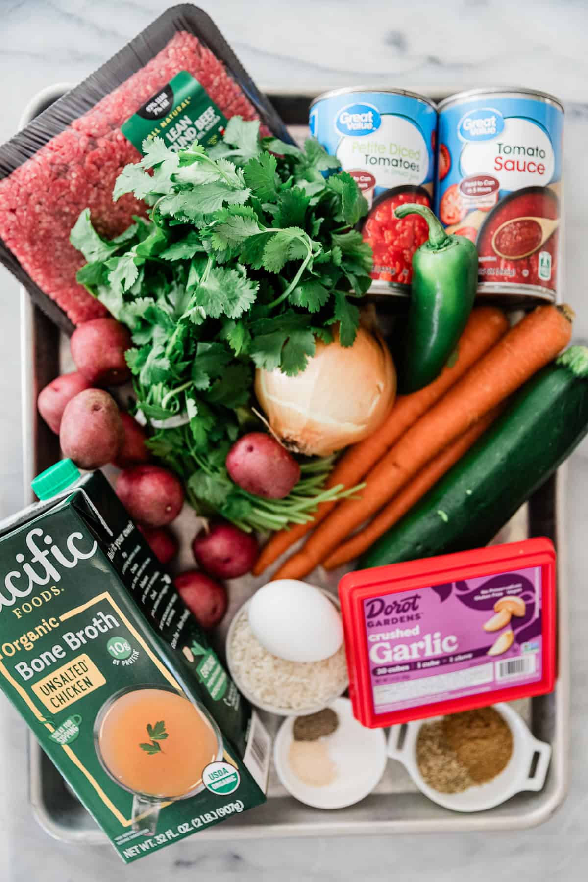 Ingredients to make albondigas soup on the table before cooking.