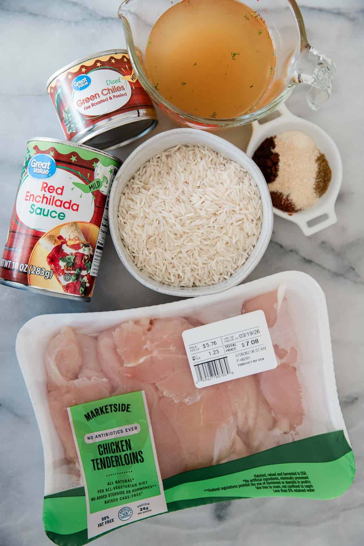 Ingredients to make this burrito bowl with chicken on a table.