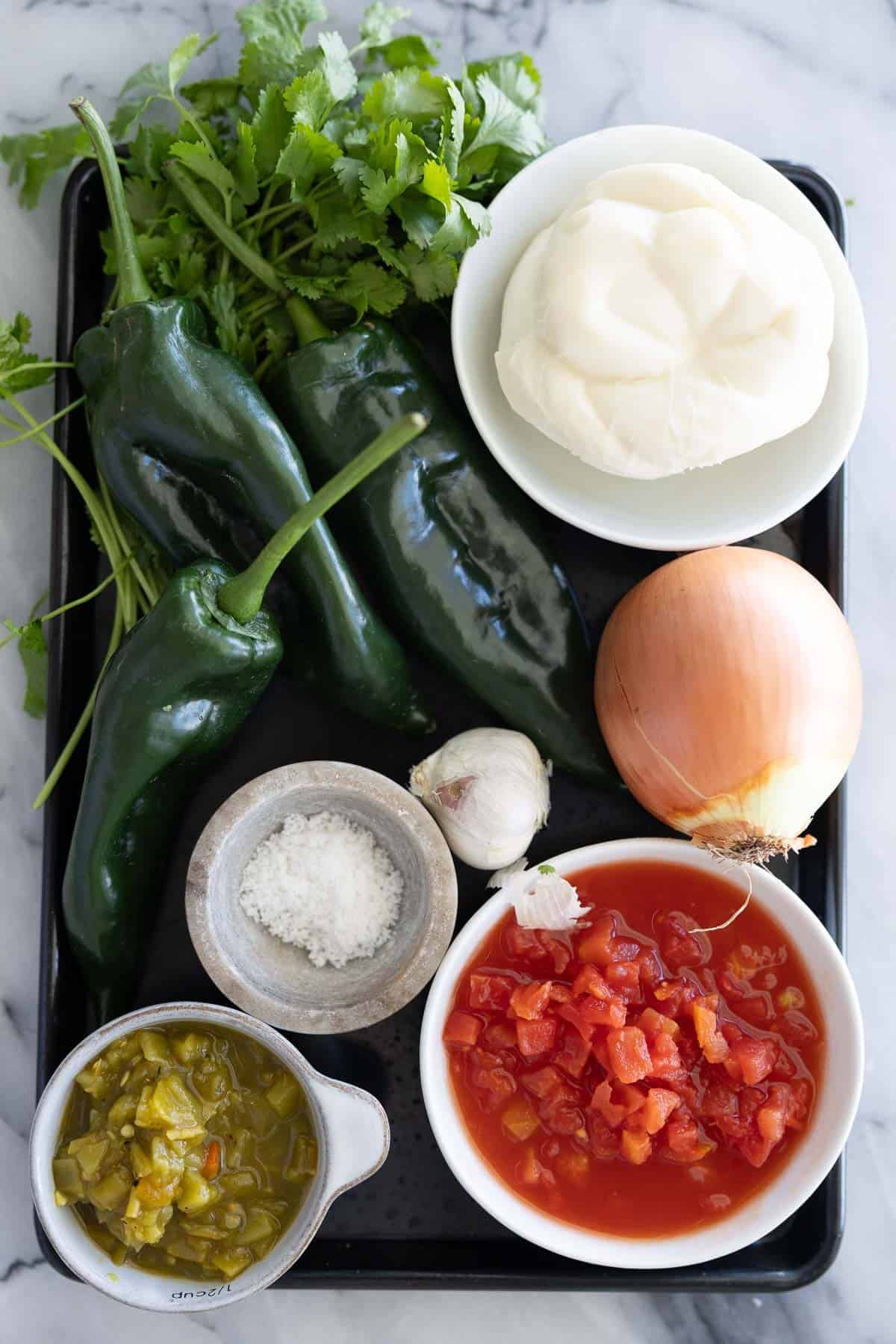 Ingredients to make this baked chile rellenos recipe on a table.