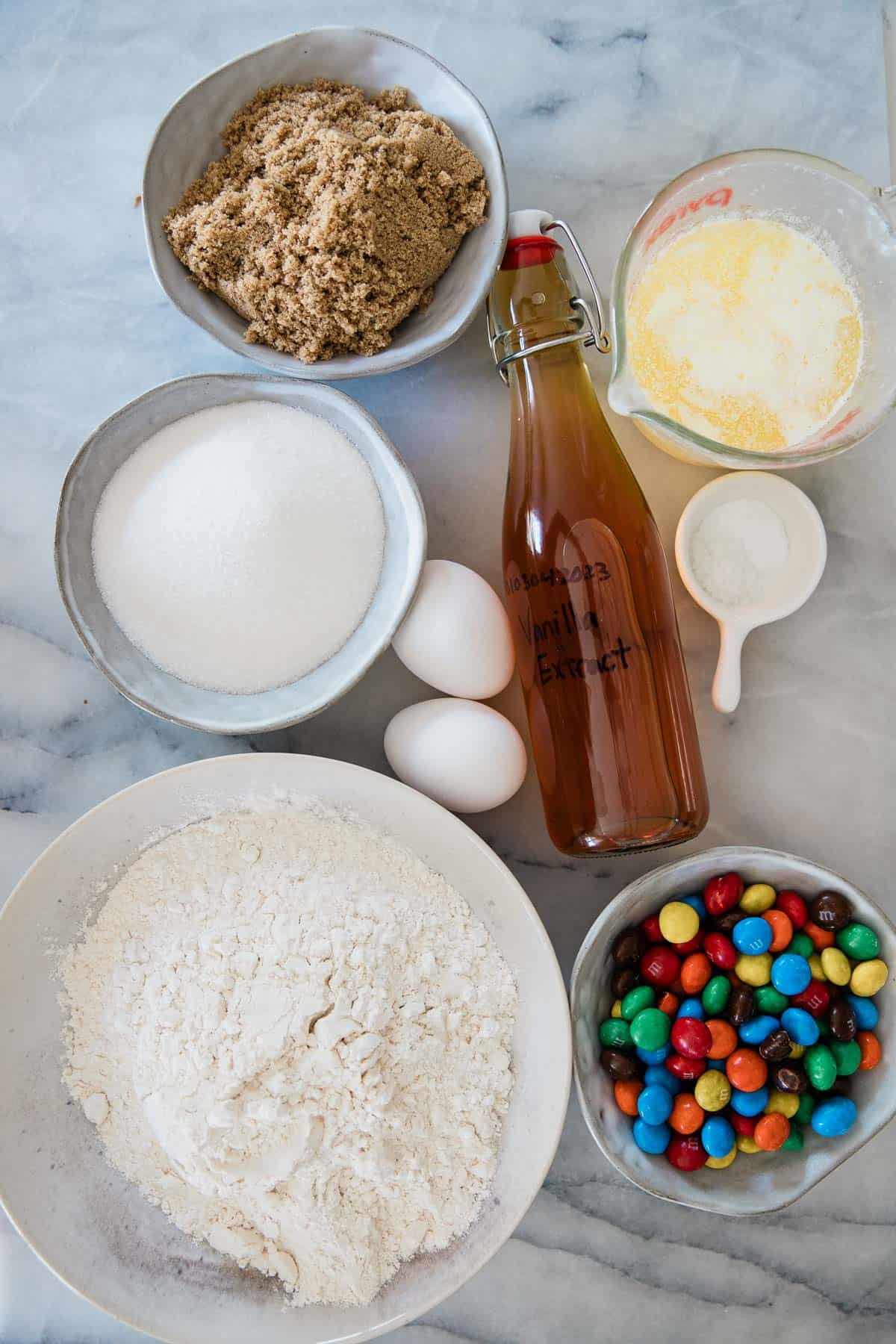 Ingredients to make this blondies recipe laid out in bowls on a tabletop. 
