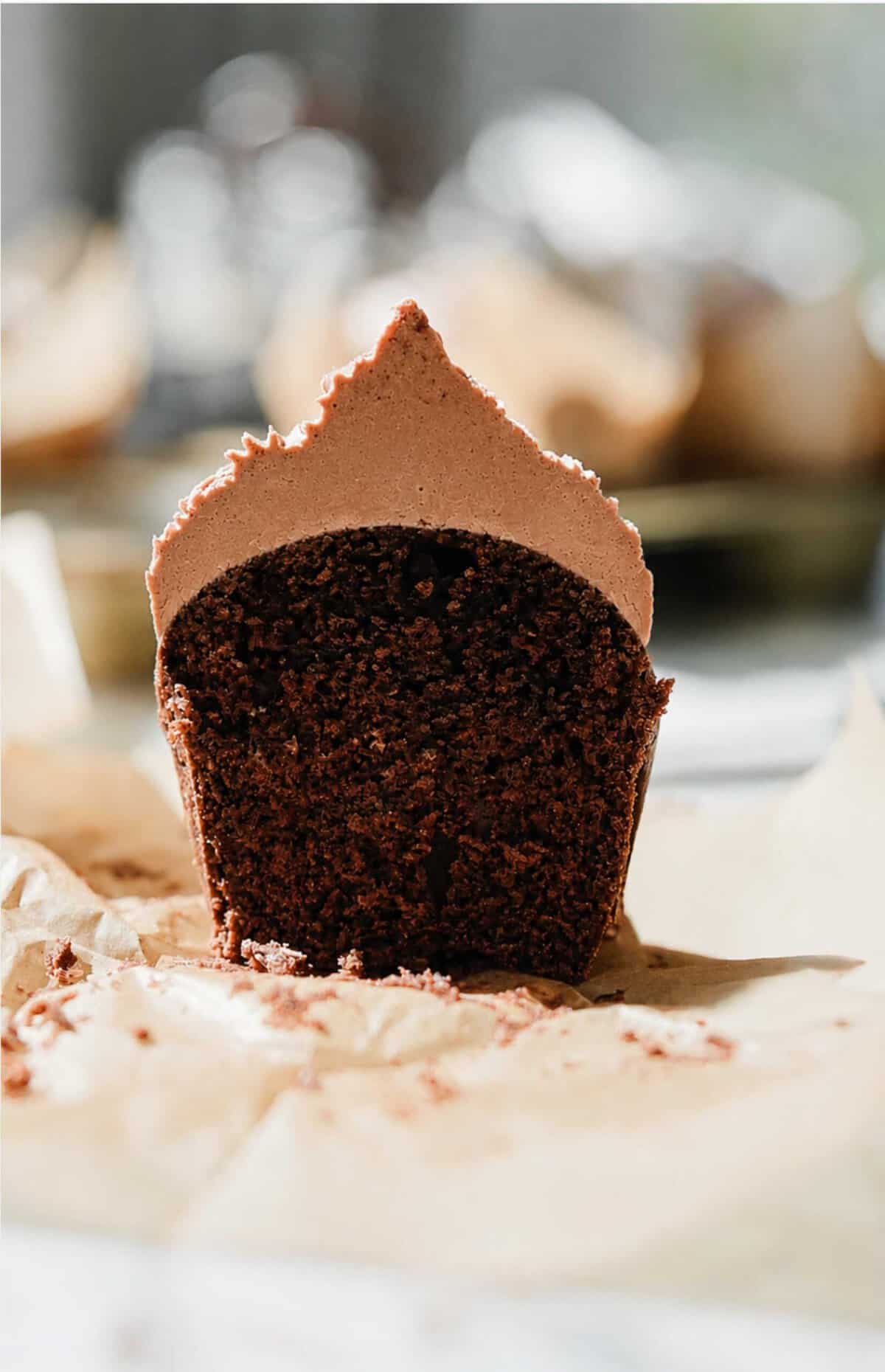 Easy chocolate cupcake cut in half to show moist center. 