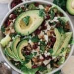 Avocado lettuce salad with cilantro on top.