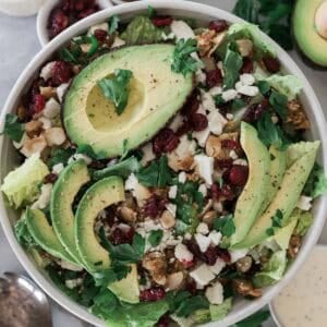 Avocado lettuce salad with cilantro on top.