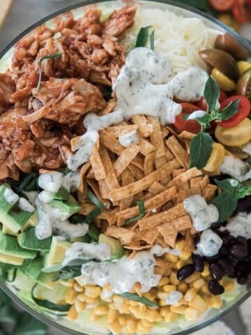 BBQ chicken salad combined in a bowl.