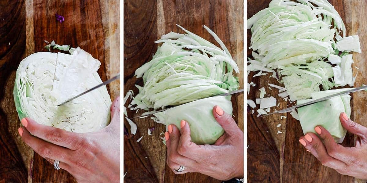 Cabbage cored and cut on a cutting board.